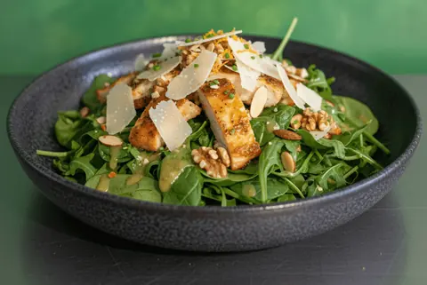 Citrus Chicken Salad: roasted chicken, baby spinach, rocket, nuts, parmesan cheese and citrus dressing